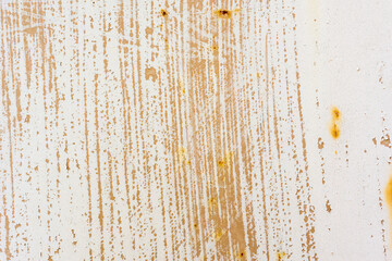 Background of rusty metal wall covered with paint peeling off