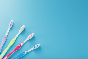 Colorful toothbrushes for the family on a blue background.
