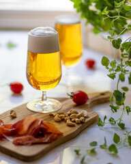 Beer wheat blonde in glass with foam on white background 