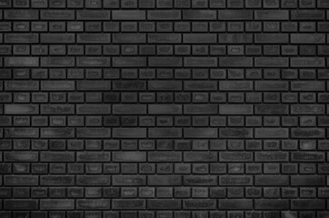 Empty texture background of black brick wall. Home, office, cafe, restaurant design backdrop.
