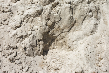 Sand quarry. Vertical wall of an abandoned quarry. As a natural background and texture.