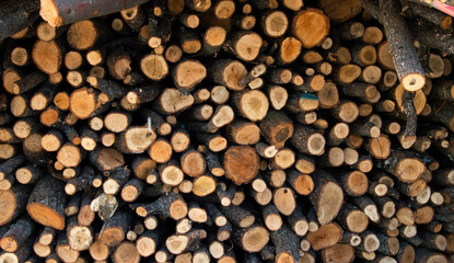 wood for burning stacked round brown wood