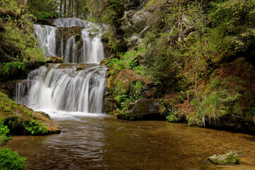 Fototapeta na wymiar long exposure of a waterfall in the mountains