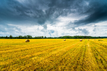Haystacks in the field before the storm