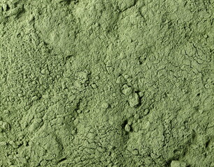 Organic powder wheat grass background and texture, top view