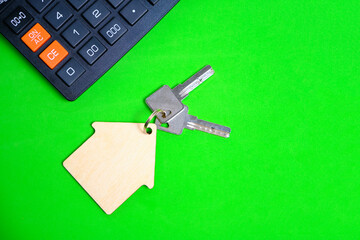Calculator House Keys Concept of buying and selling housing, mortgages and renting a house or apartment