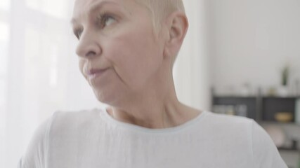 Woman measuring waste with tape, unhappy with result, weight control dieting