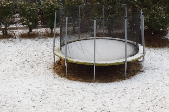 trampoline with snow at winter time