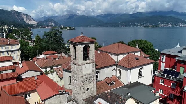 Low altitude aerial view of Stresa is a town and comune of about 5,000 residents on the shores of Lake Maggiore in the province of Verbano Cusio Ossola in the Piedmont region of northern Italy 4k