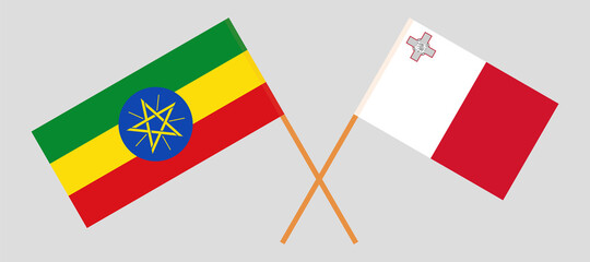Crossed flags of Ethiopia and Malta. Official colors. Correct proportion