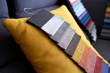 Colorful upholstery fabric samples on the sofa