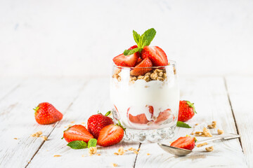 Greek yogurt with fresh strawberry and granola. Parfait.