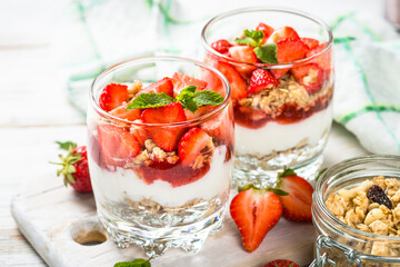 Greek yogurt with fresh strawberry and granola. Parfait.