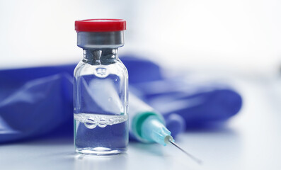 Close-up glass ampoule with vaccine against coronavirus,COVID19,influenza,diabete and other...