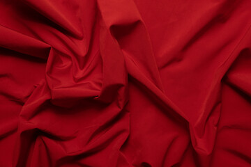 Texture of wrinkled, crumpled red fabric close-up. background for your mockup