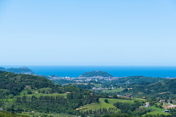 Fototapeta na wymiar A far away of a landscape surrounding a coastal city of San Sebastian, Spain