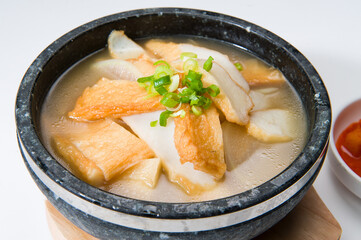 Asan tofu hot pot with soup at a Korean restaurant.  White background..........