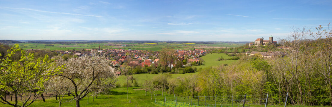 Aerial Panorama of the City of Colmberg with the castle, from a hill, with spring trees, Franconian Heights, Bavaria, South Germany