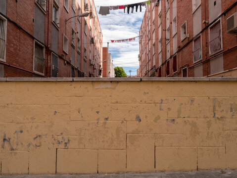 POOR NEIGHBORHOOD STREET WITH CLOTHES AND GARBAGE