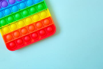 Rainbow pop it toy fidget on a background