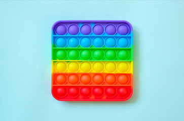 Rainbow pop it toy fidget on a background