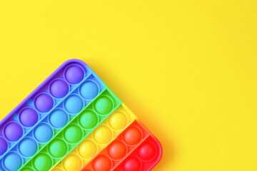 Rainbow pop it toy fidget on a background