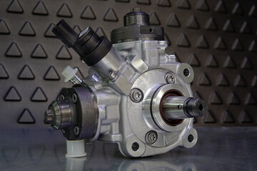 Close-up of a new original high-quality fuel injection pump. Selected focus.