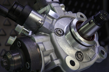 Fototapeta na wymiar Close-up of a new original high-quality fuel injection pump. Selected focus.