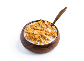 Corn flakes with milk in wooden bowl isolated on white background