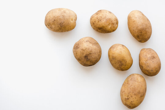 young potatoes on a white plate, potatoes on a white plate 