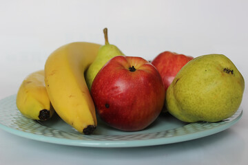 fresh fruit on a blue plate