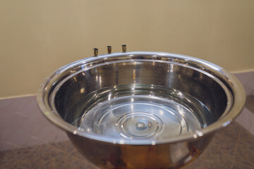 The baptism of a child in the church, the interior of the church.