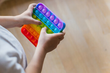 Antistress toy pop it fidget baby boy hands.