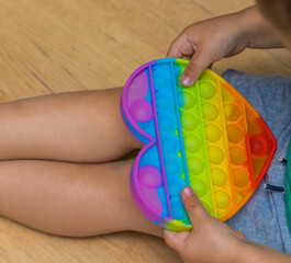 Antistress toy pop it fidget baby boy hands.