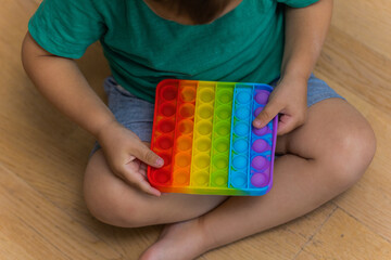 Antistress toy pop it fidget baby boy hands.