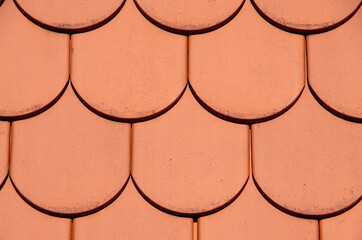 Orange fish scalc roof as a texture or background