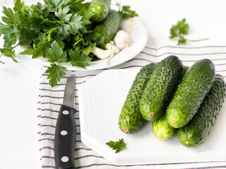 parsley and cucumbers on the table