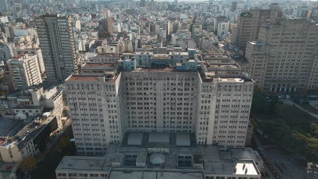 Aerial pan right of Clinic Hospital and famous public Faculty of Medicine near Houssay Square, Buenos Aires