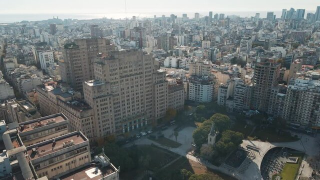 Aerial dolly in of Clinic Hospital and prestigious public Faculty of Medicine near Houssay Square, Buenos Aires