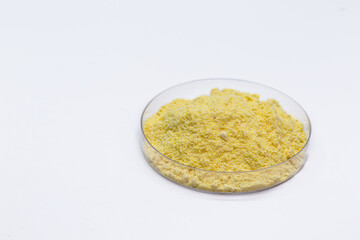 sulfur powder in petri dish, chemical substance for industrial use