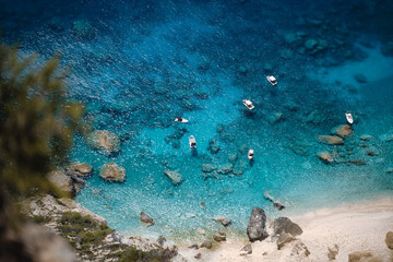 Pleasure boats anchored at Mizithres cliff rock in Zakynthos Ionian island, Greece