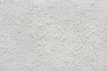 Sand texture, white sandy beach background.