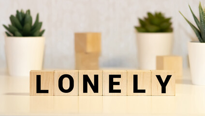 LONELY word on wooden blocks, problem concept