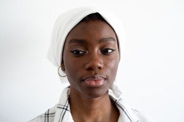 Portrait of a young woman wearing a white headscarf