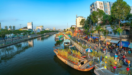 Flowers boat at flower market along canal wharf. This place Farmers sell apricot blossom and other...