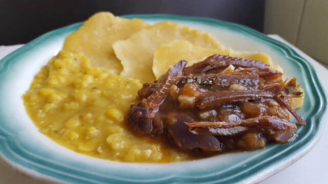 Smoked Herrings, Dahl and Dumplings. A traditional dish of Trinidad and Tobago in the Caribbean. 