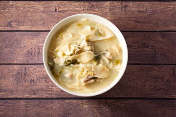 WANTAN SOUP WITH NOODLES, CHICKEN, QUAIL EGGS, CHINESE CABBAGE AND HOLANTAO
