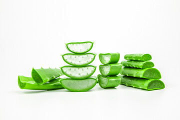 Aloe vera, Close-up slices of green fresh aloe vera plant stacked and aloe vera stalk or leaves with water dropping isolate on white background.