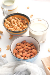 cashew nut , almond nut and milk on table 