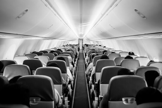 Passengers Traveling By A Plane, Shot From The Inside Of An Airplane